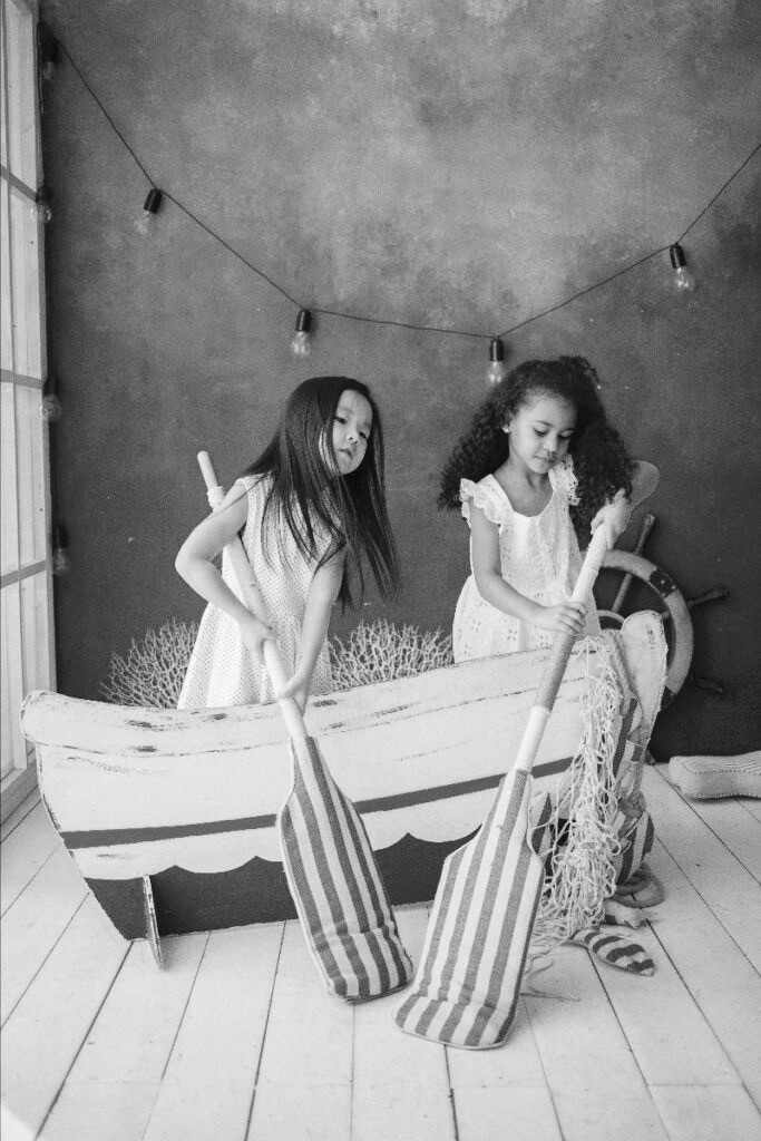 Children Playing In A Wooden Boat