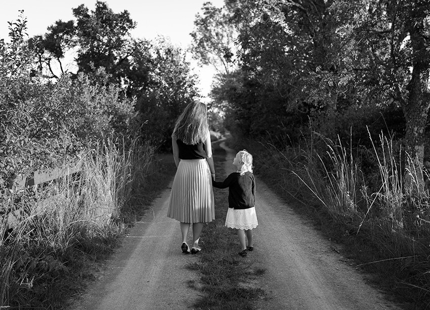 Governess And Child Taking A Walk In Nature