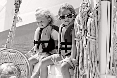 kids sailing on sailboat