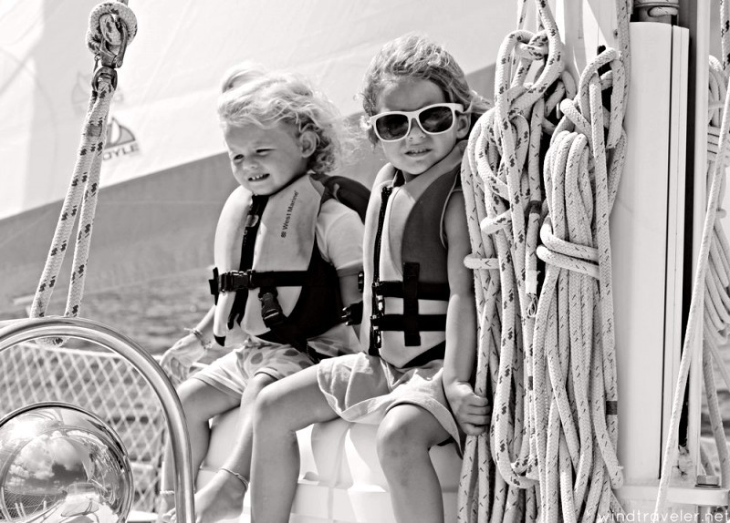 kids sailing on sailboat