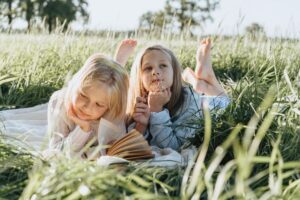 Children Reading In Nature