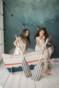 Children Playing In a Wooden Boat