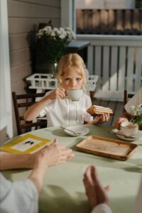 Child Having Dessert In A Restaurant