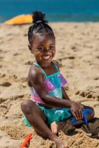 Child Playing In The Sand 