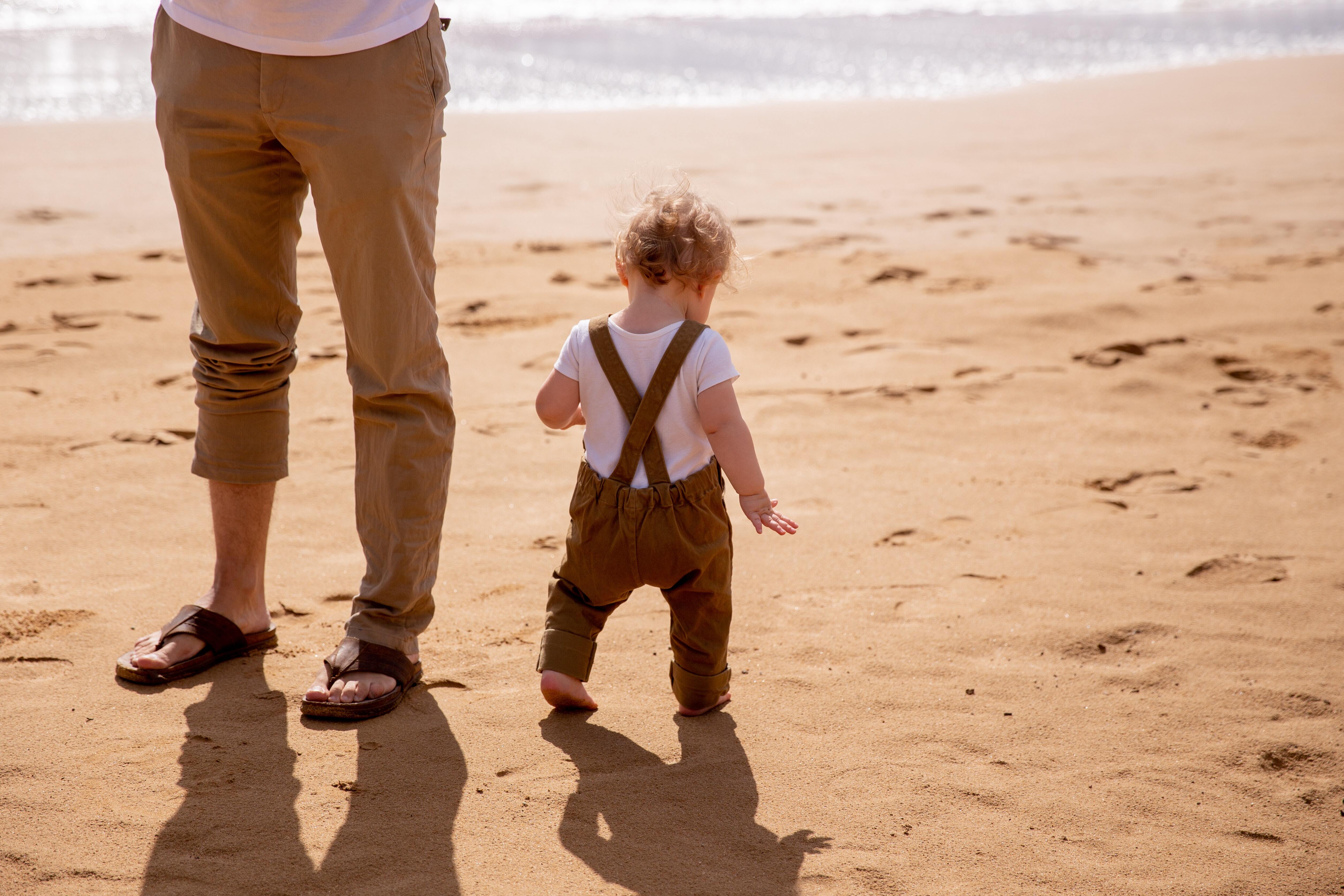 Child Walking On Sand