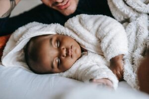 Kid Sleeping Next To Parent