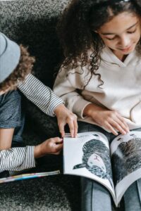 Children Reading Book on Martin Luther King Jr.