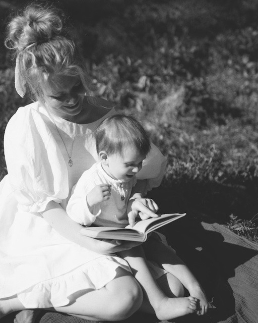 Nanny/Tutor Reading A Book To Toddler