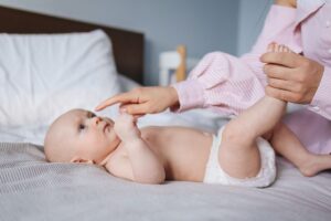 Baby Lying Down Wearing A Diaper 