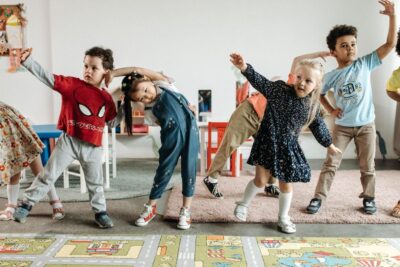 Four Kids Dancing In Playroom