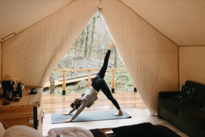 Person Doing Yoga In Glamping Tent
