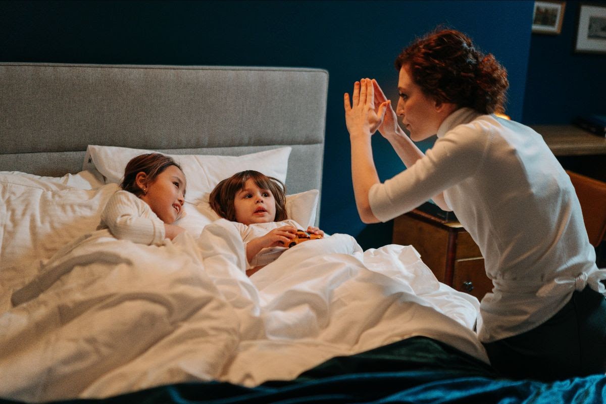 Nanny Sharing Bedtime Story To Children