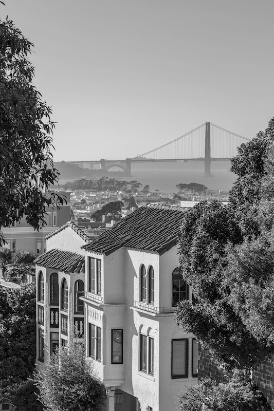 Houses With The Golden Gate Bridge Visible In The Background