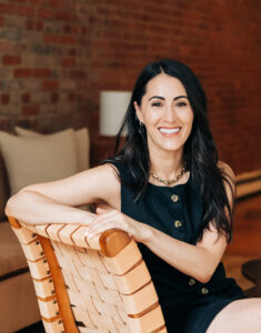 Sarah Rueven Sitting On A Chair 