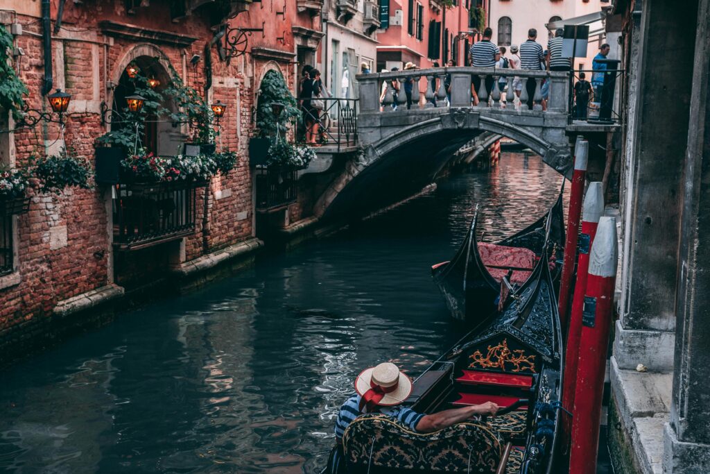 Gondola On A Canal In Venice