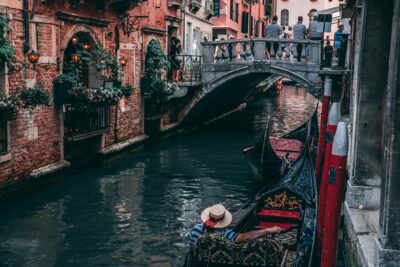 Gondola On A Canal In Venice