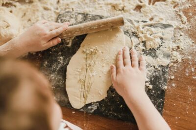 Kid Rolling Dough At Cooking Camp