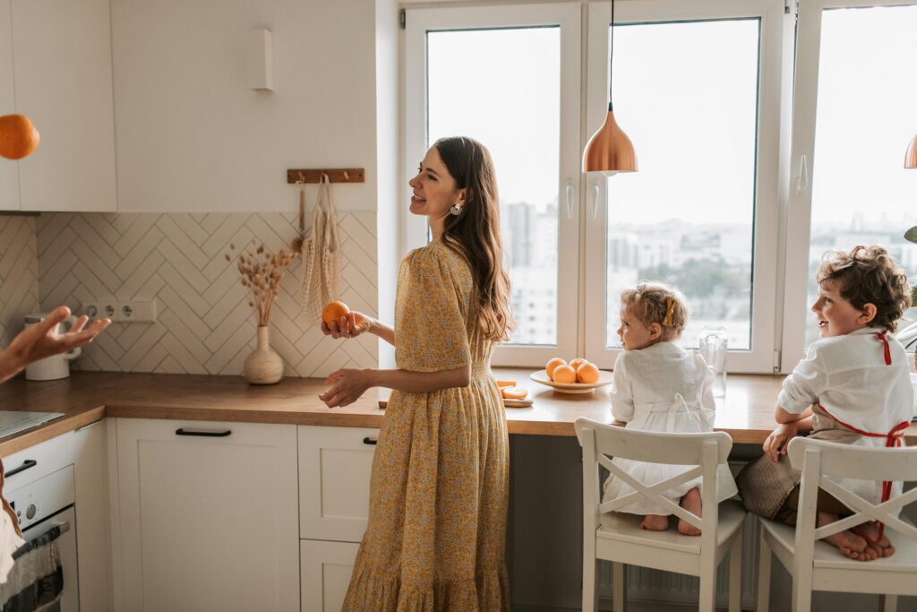 Nanny Leading Cooking Activity With Two Children