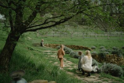 Children Playing Outdoors In Springtime