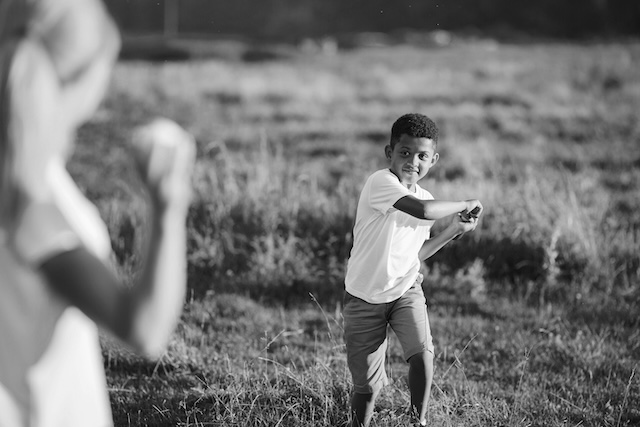 Nanny And Child Playing Baseball In Houston