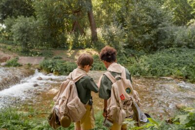 Two Kids Exploring Forest During Summer Program