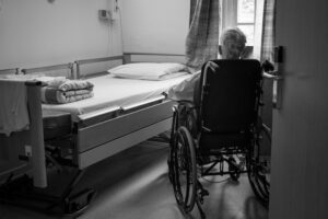 Senior Man In Wheelchair In Facility-Based Care Setting