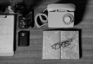 Vintage Telephone And Notebook