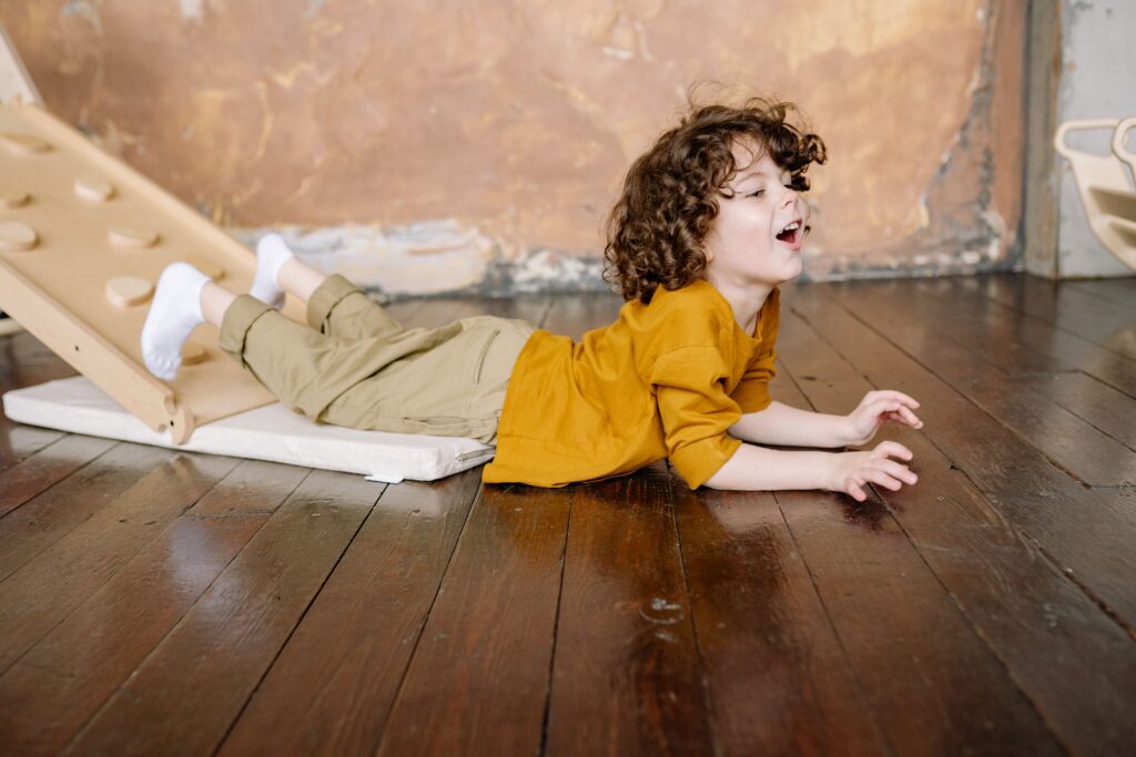 Child Playing While Lying Down
